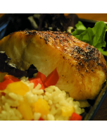 A fresh Black Cod fish displayed on a clean surface.