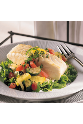 Freshly caught Halibut fillets displayed on a clean surface.