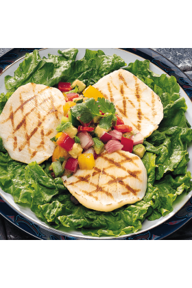 Fresh halibut cheeks displayed on a bed of ice in a seafood market.