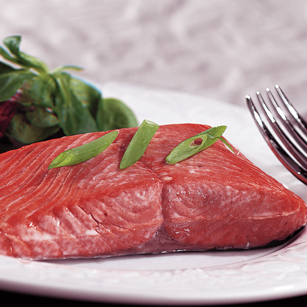 16 Copper River Sockeye Salmon Fillets neatly arranged, showcasing their vibrant red color and fresh quality.