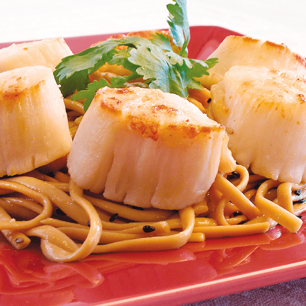 Eight packs of Jumbo Scallops displayed in clear packaging.