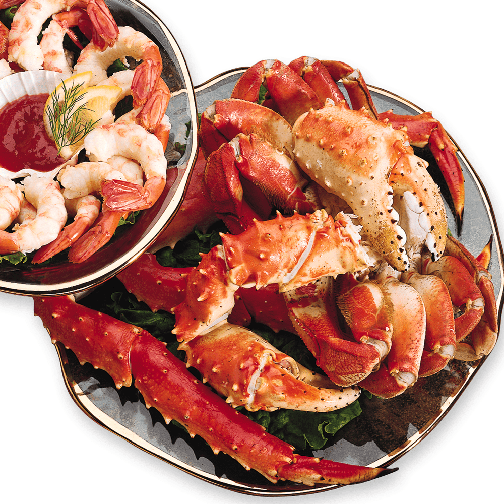 A variety of fresh shellfish including clams, oysters, and prawns, beautifully arranged in a sampler platter.