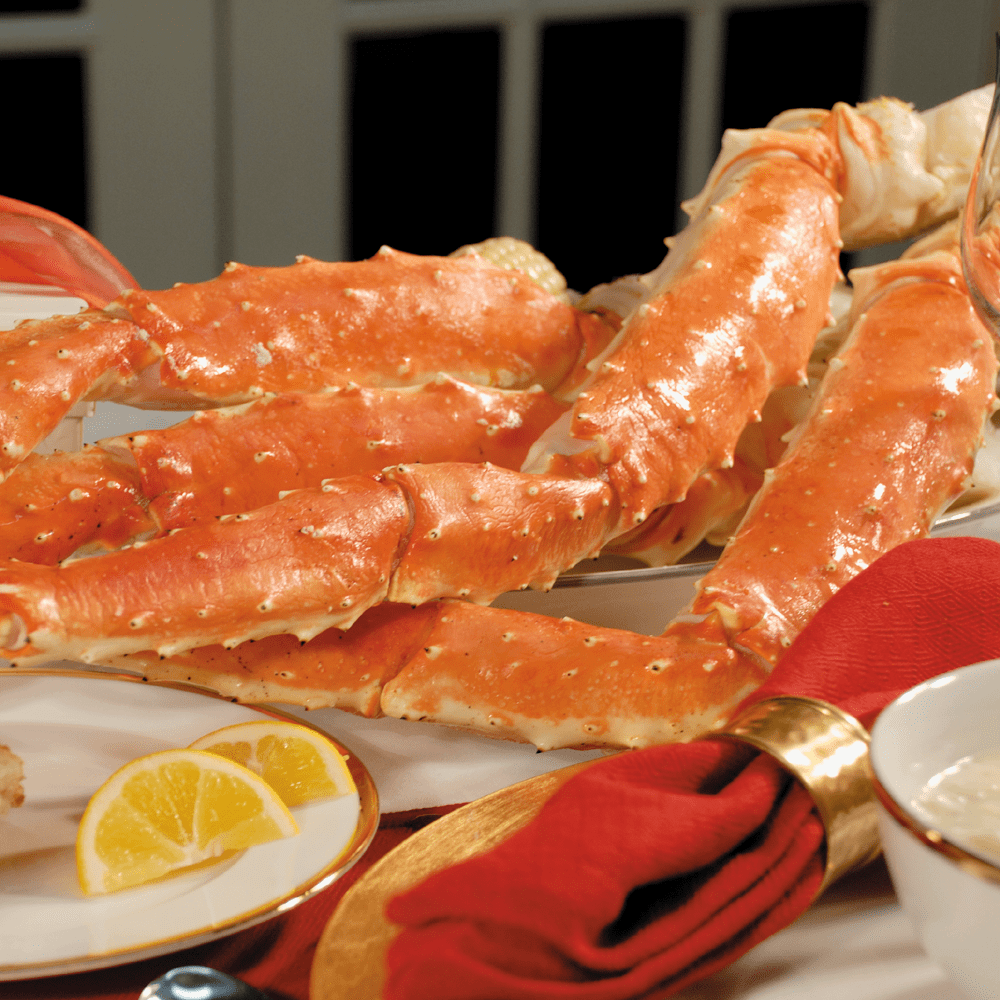 A large, fresh Jumbo King Crab with a hard, spiky shell and long, strong legs.